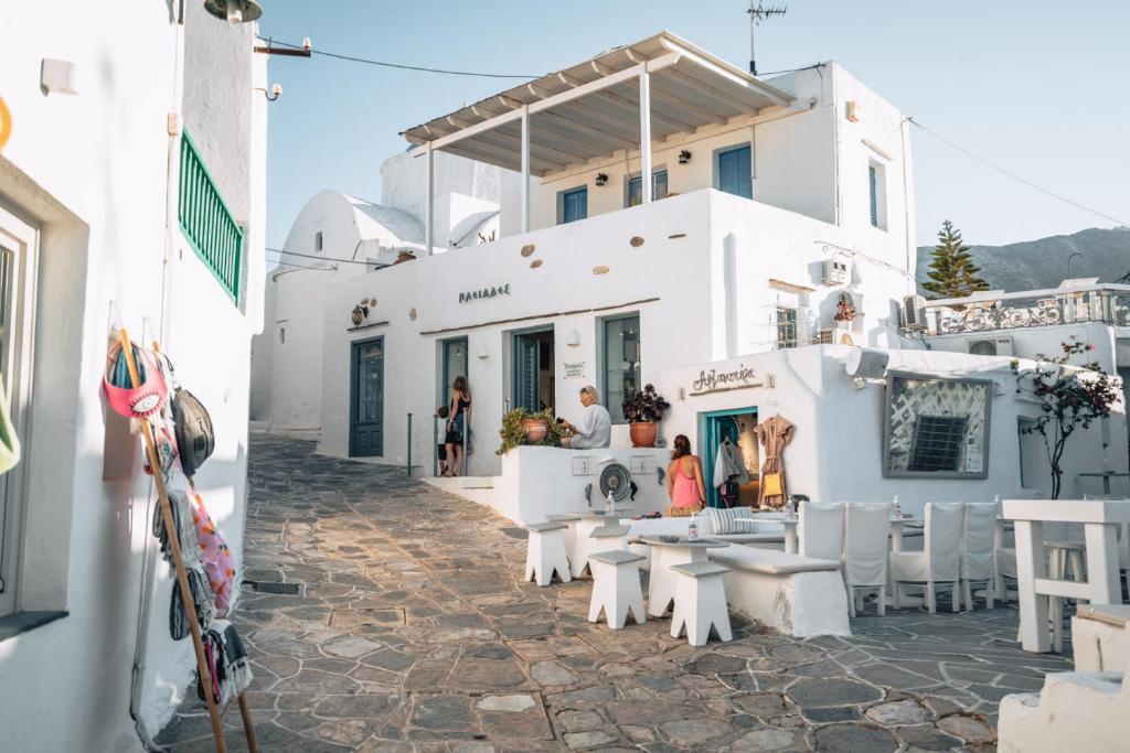 a group of people standing outside of a building at Avra Guestroom in Apollonia