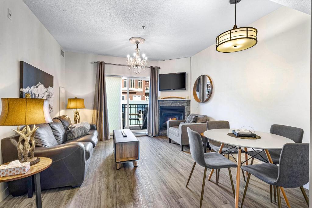 a living room with a couch and a table at Newly renovated Blue Sky - Family Fun - 2 Bed -2 Bath in Canmore