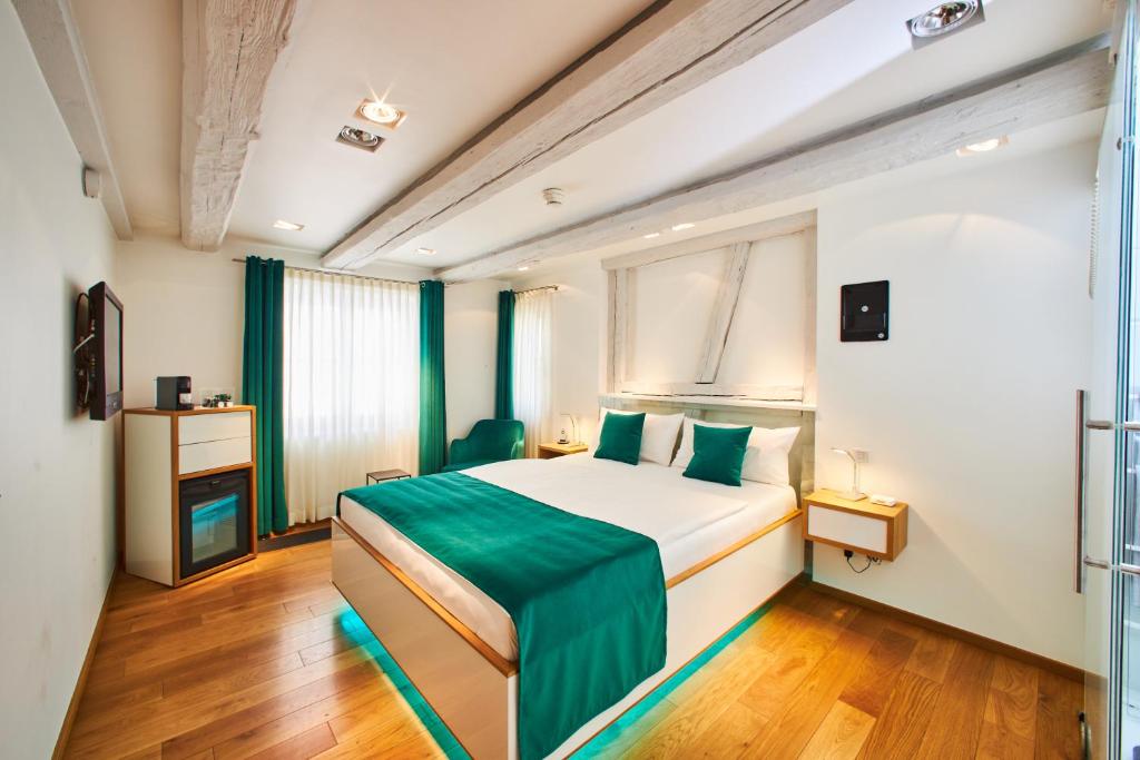 Postel nebo postele na pokoji v ubytování Hotel Max am See