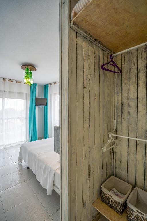 Postel nebo postele na pokoji v ubytování LOS NAREJOS Hotel