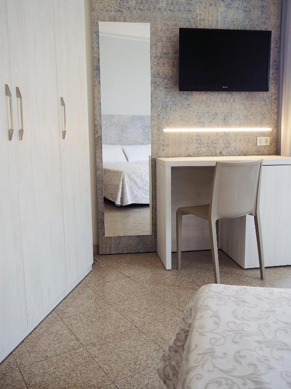 Postel nebo postele na pokoji v ubytování Hotel Olympia