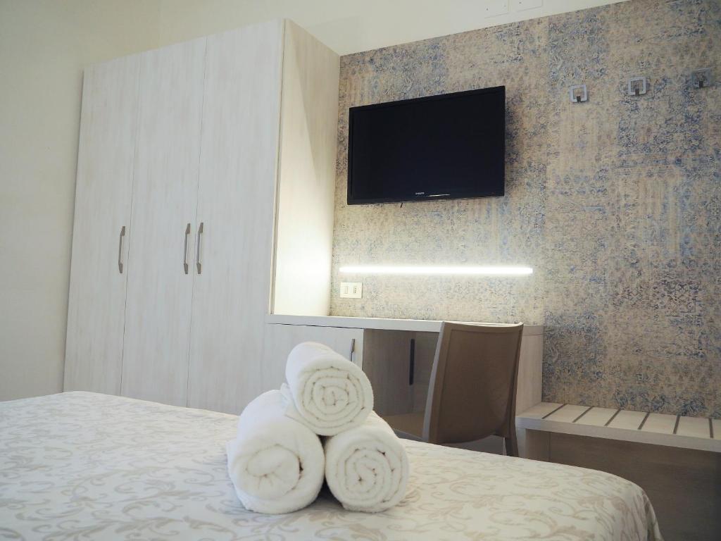 Postel nebo postele na pokoji v ubytování Hotel Olympia
