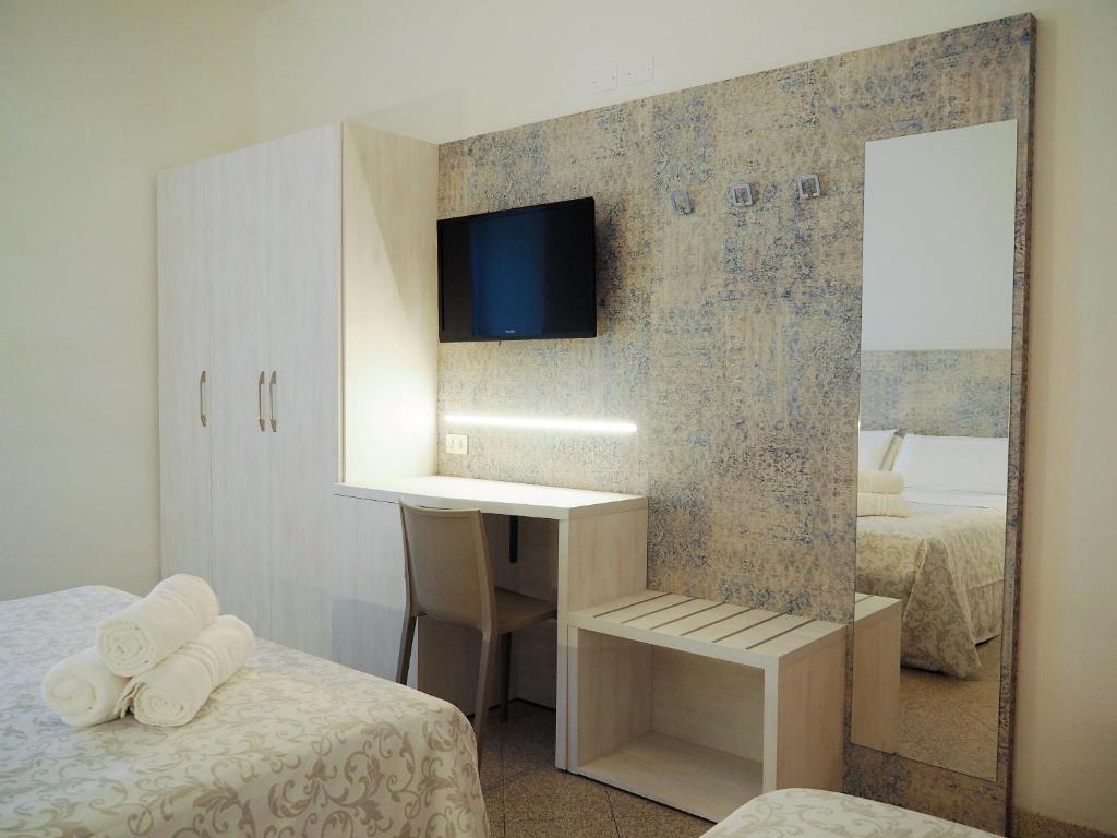 Postel nebo postele na pokoji v ubytování Hotel Olympia