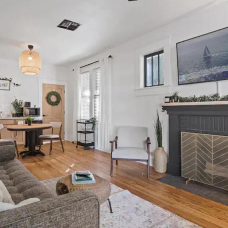 a living room with a couch and a fireplace at Family Vacation Home in Tampa, Florida in Tampa