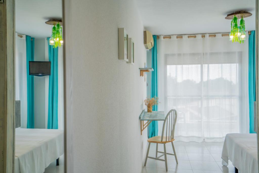 Postel nebo postele na pokoji v ubytování LOS NAREJOS Hotel