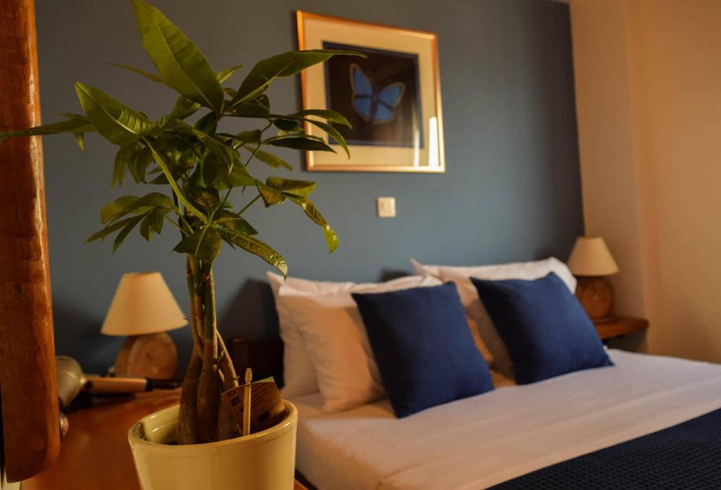 Blu Casa Del Mare tesisinde bir odada yatak veya yataklar