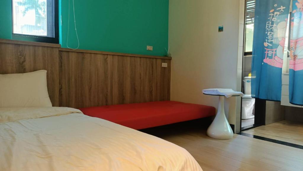 Postel nebo postele na pokoji v ubytování 禾心居He Xin Ju Homestay