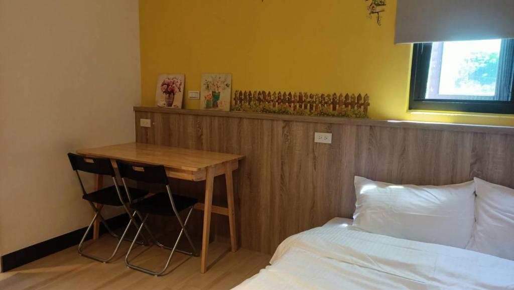 Postel nebo postele na pokoji v ubytování 禾心居He Xin Ju Homestay