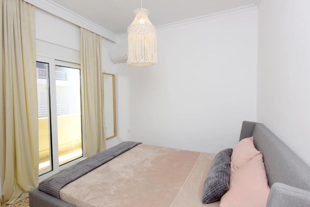 Postel nebo postele na pokoji v ubytování Naya Ixia Rhodes Apartment