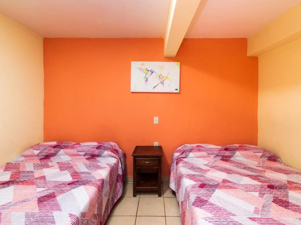 Postel nebo postele na pokoji v ubytování Hotel Zaragoza, San Juan de los Lagos
