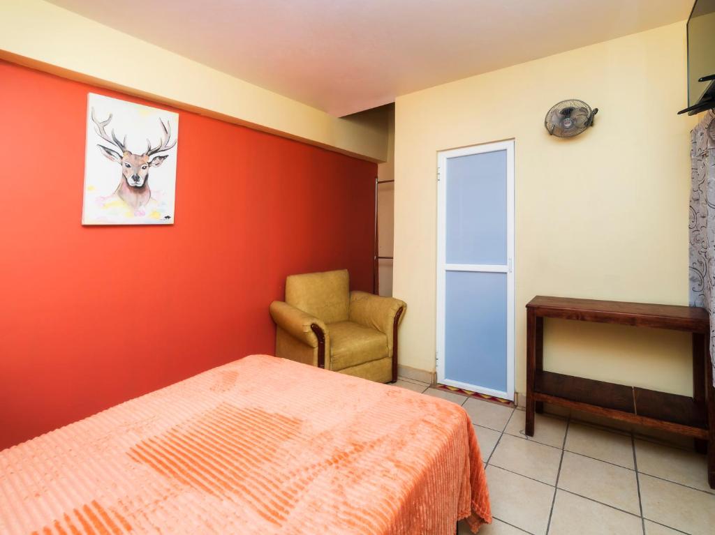 Postel nebo postele na pokoji v ubytování Hotel Zaragoza, San Juan de los Lagos