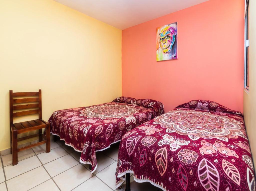 Postel nebo postele na pokoji v ubytování Hotel Zaragoza, San Juan de los Lagos