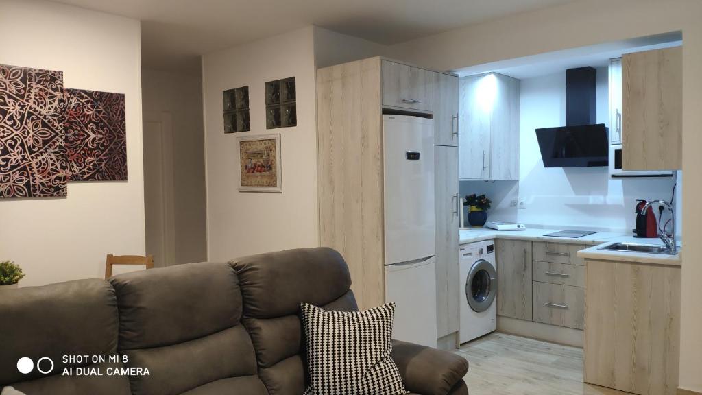 A kitchen or kitchenette at ALCAZAR VIEJO SUITE Tourist Córdoba