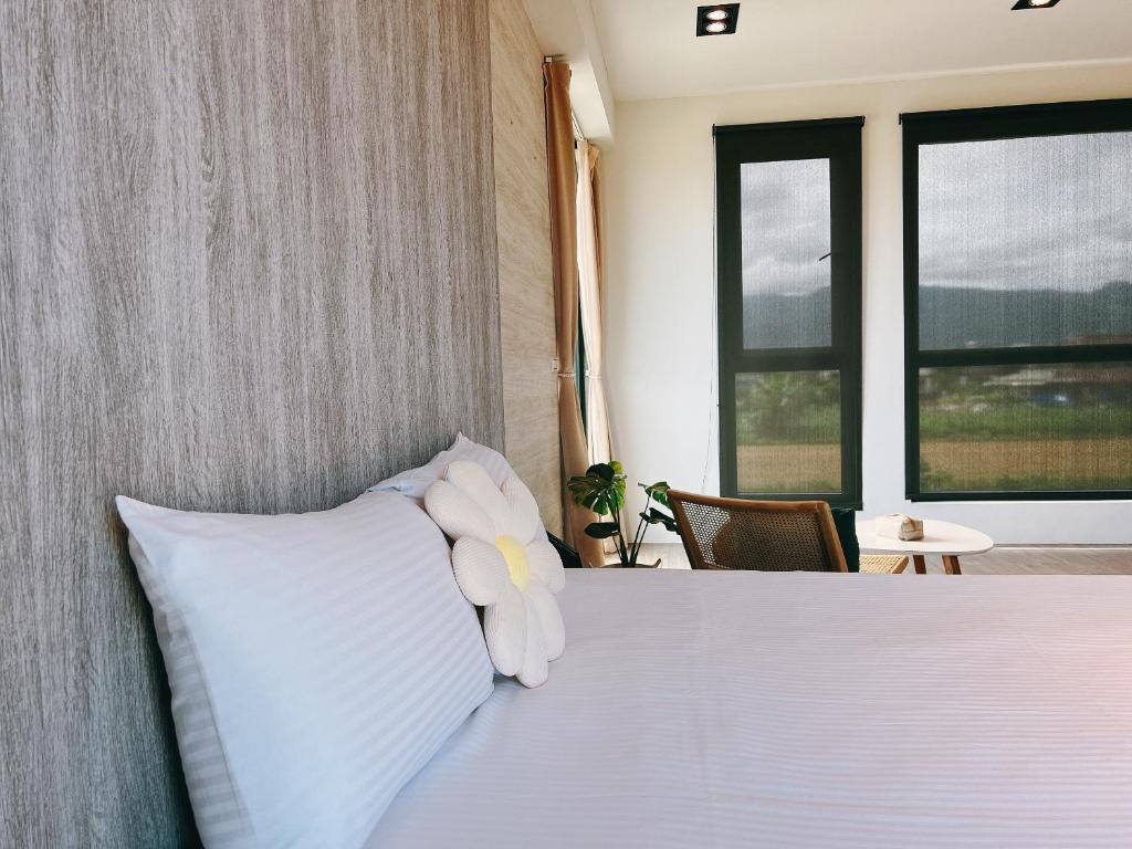 Postel nebo postele na pokoji v ubytování Wei Wei Chu B&B