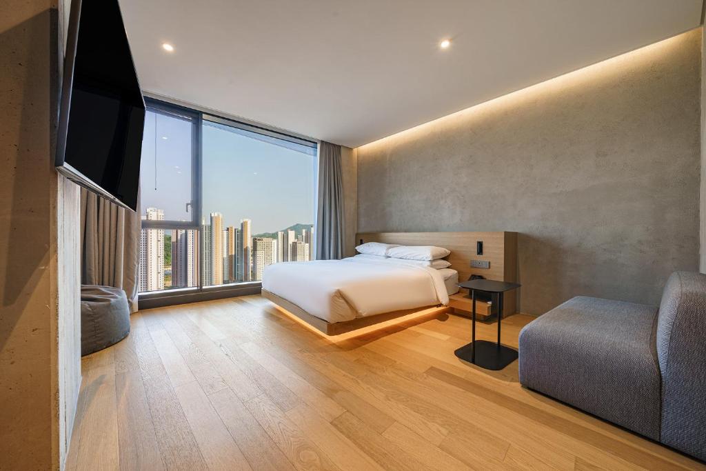 Postel nebo postele na pokoji v ubytování Take Hotel Seoul Gwangmyeong