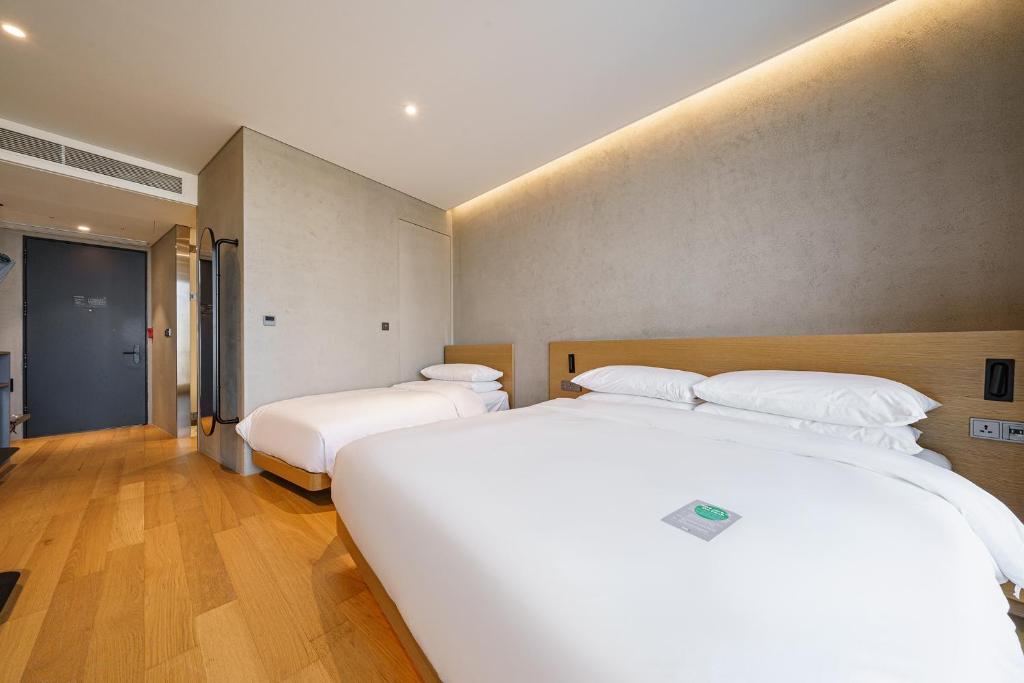 Postel nebo postele na pokoji v ubytování Take Hotel Seoul Gwangmyeong