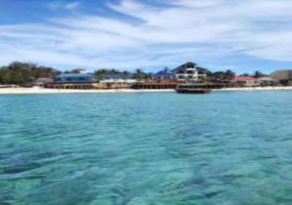 a view of the ocean from a boat in the water at Magharibi House in Nungwi