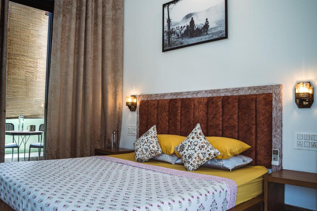 Una cama o camas en una habitación de Le Fort Homestay