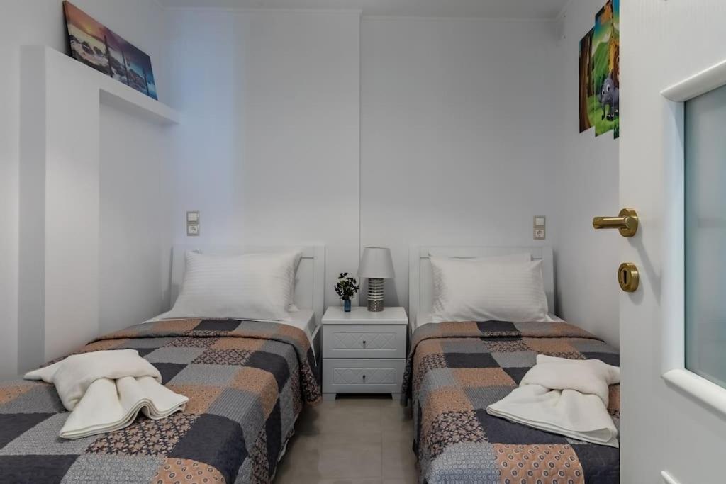 Postel nebo postele na pokoji v ubytování Nevila House