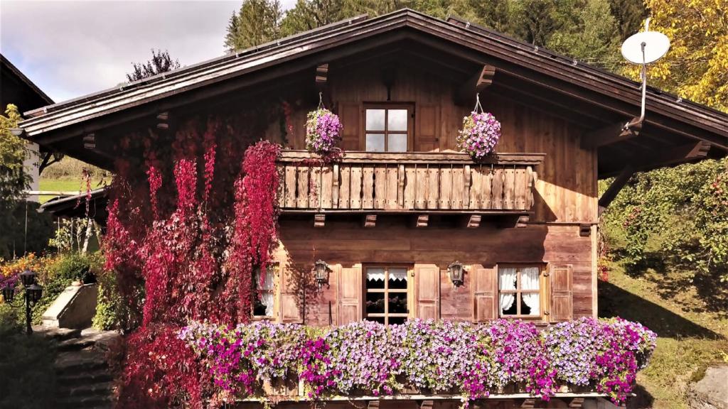 a house with flowers in front of it at Mühlenhäuschen in Bad Koetzting