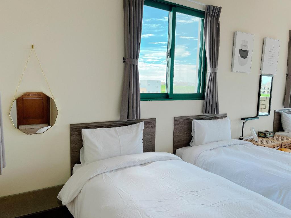Postel nebo postele na pokoji v ubytování Azumaya guest house