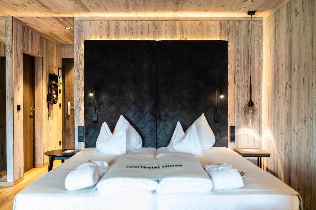 Posteľ alebo postele v izbe v ubytovaní Dolomiten Residenz - Sporthotel Sillian