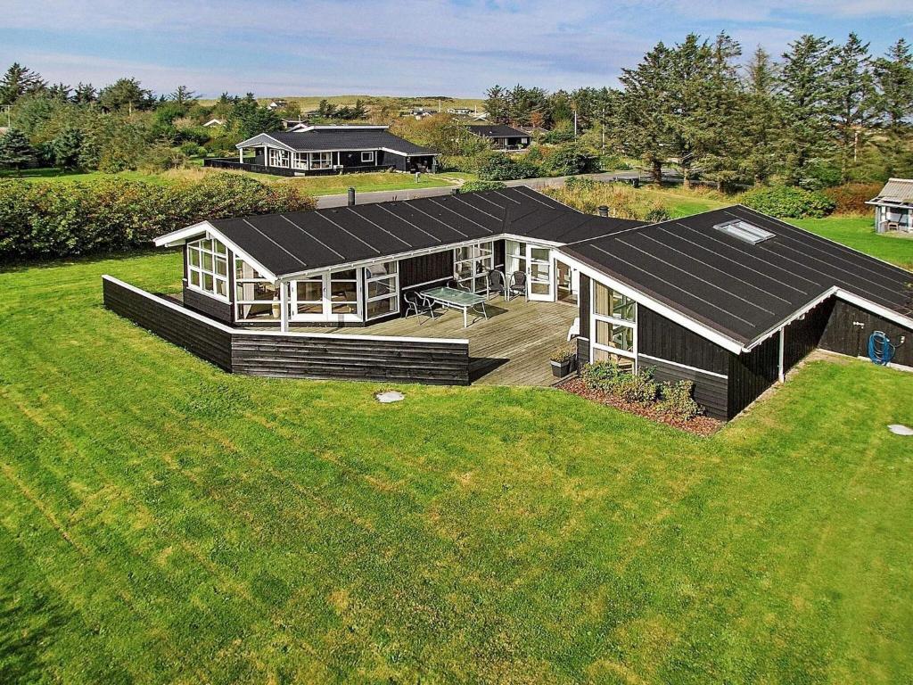 an aerial view of a house with a large yard at 6 person holiday home in Hj rring in Hjørring