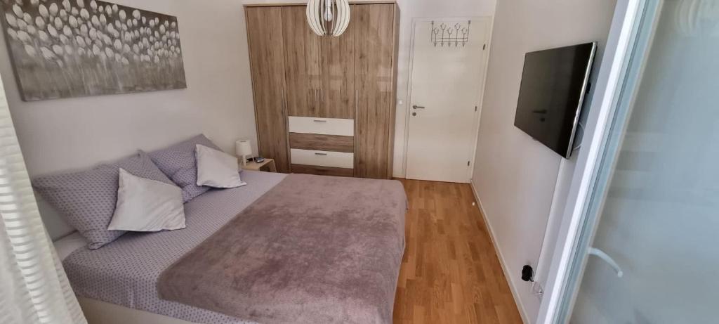 Łóżko lub łóżka w pokoju w obiekcie City Style Apartment-New Zagreb