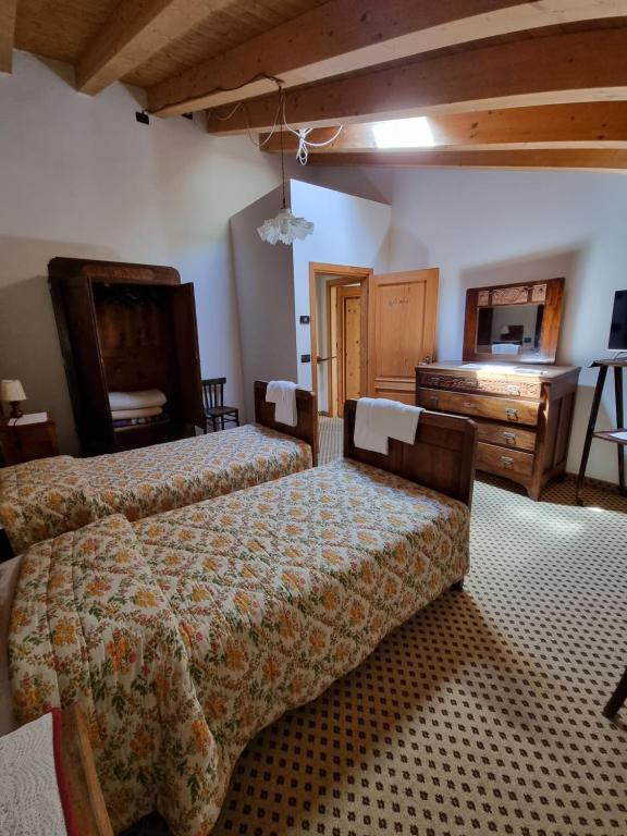 Postel nebo postele na pokoji v ubytování Trattoria Albergo all'Alpino