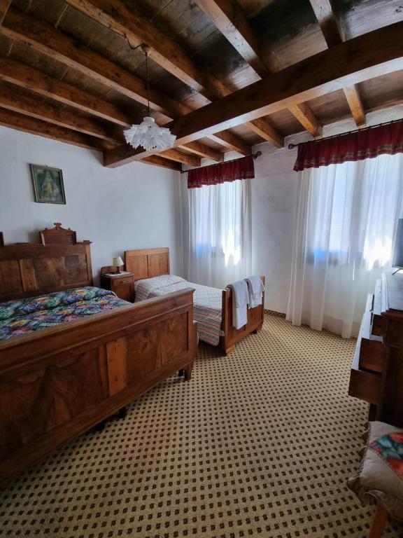 Postel nebo postele na pokoji v ubytování Trattoria Albergo all'Alpino
