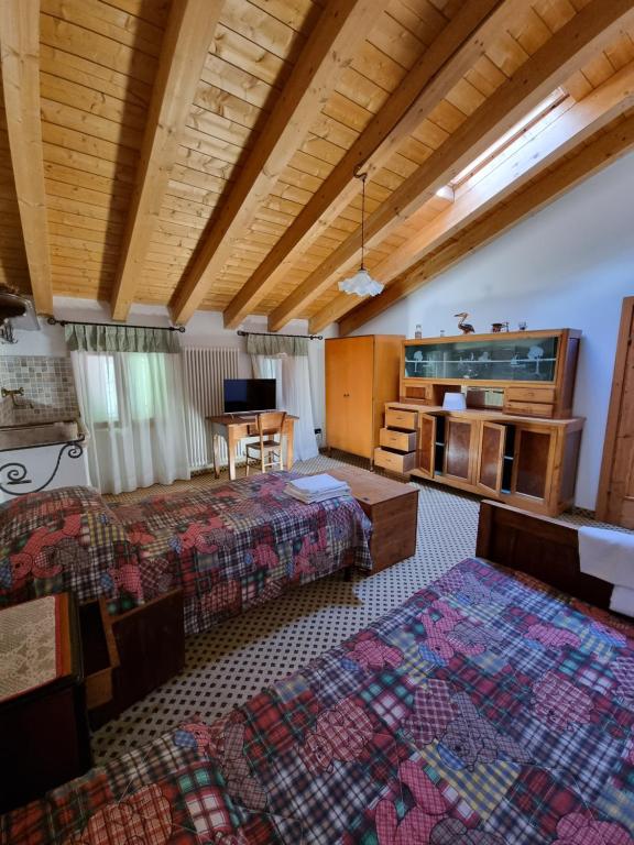 Postel nebo postele na pokoji v ubytování Trattoria Albergo all'Alpino