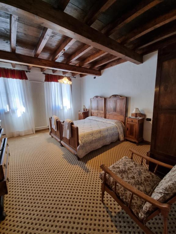 Postel nebo postele na pokoji v ubytování Trattoria Albergo all'Alpino