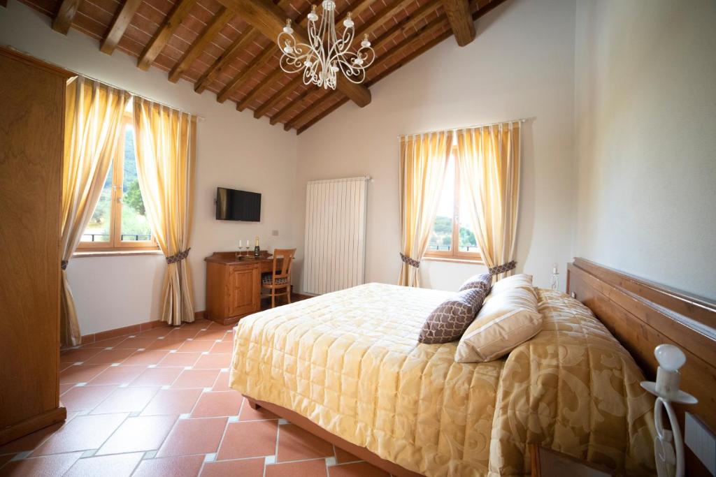 Postel nebo postele na pokoji v ubytování Agriturismo Il Dolce Vivere