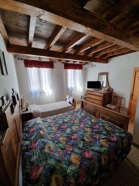 Postel nebo postele na pokoji v ubytování Trattoria Albergo all'Alpino