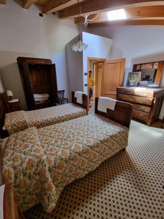 Postel nebo postele na pokoji v ubytování Trattoria Albergo all'Alpino