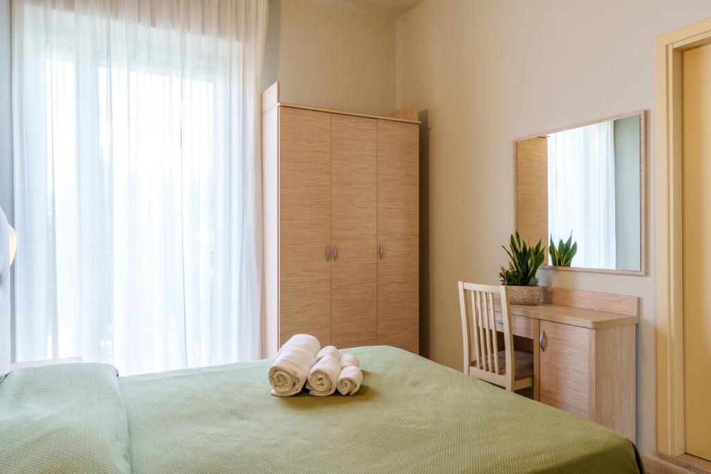 Postel nebo postele na pokoji v ubytování Hotel Rosso Blu