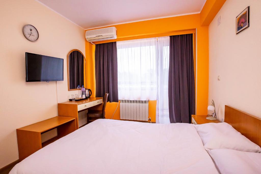 Postel nebo postele na pokoji v ubytování Komitite Complex