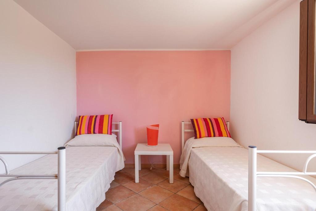 Posteľ alebo postele v izbe v ubytovaní Villa Sunrise Palm