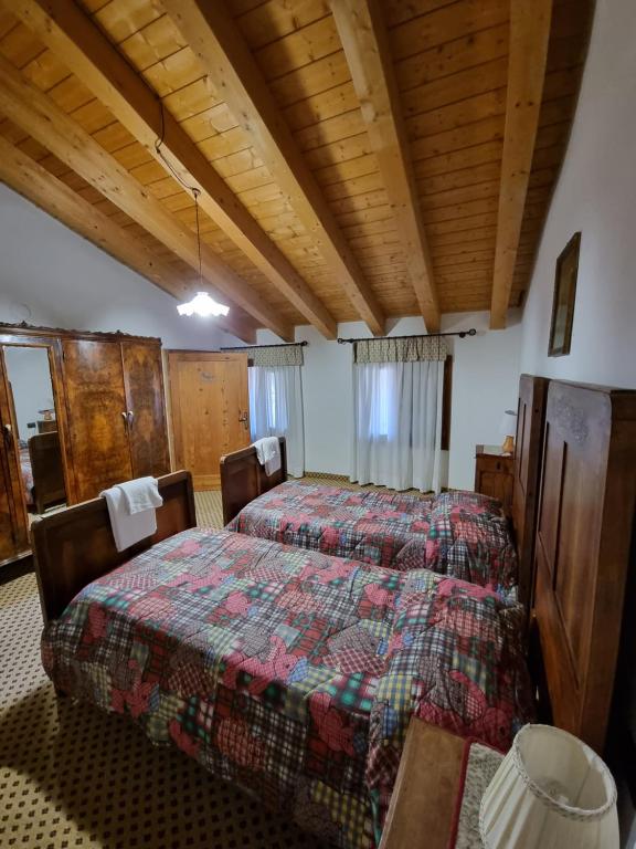 Postel nebo postele na pokoji v ubytování Trattoria Albergo all'Alpino