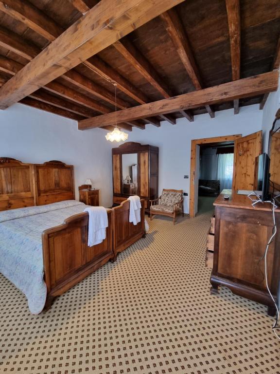 Postel nebo postele na pokoji v ubytování Trattoria Albergo all'Alpino