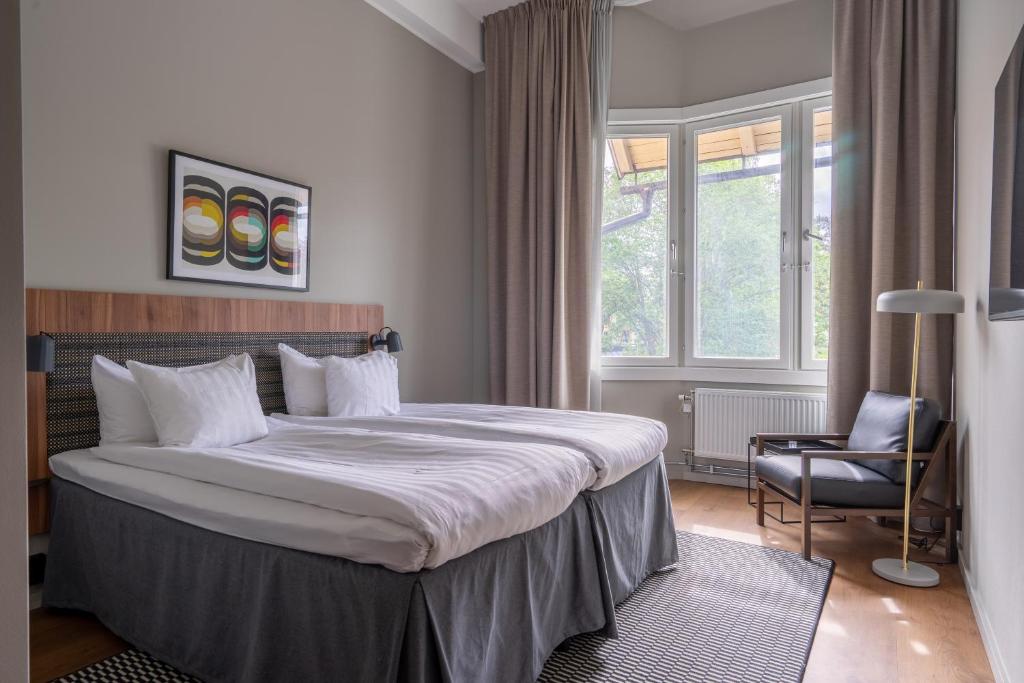 Postel nebo postele na pokoji v ubytování Quality Hotel Park Södertälje City