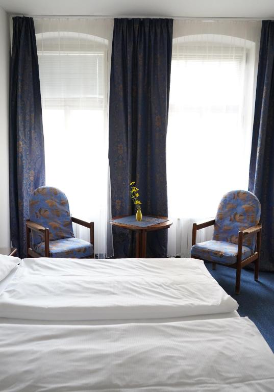 Postel nebo postele na pokoji v ubytování EA Apartmány Mozart