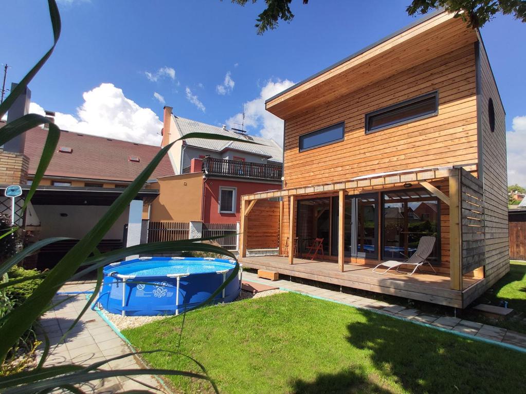 a house with a swimming pool in a yard at Chata NEMO in Hlinsko