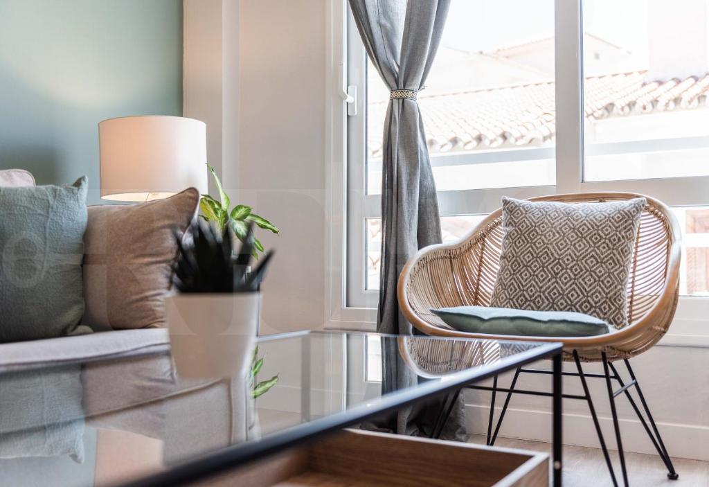 A seating area at Sunny & modern apartment - Center by REMS
