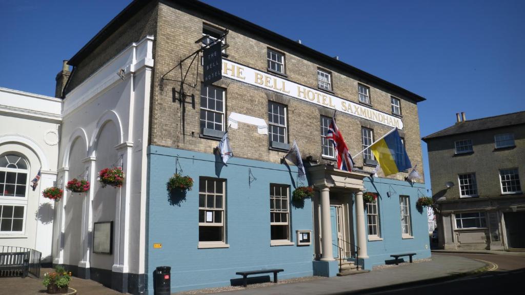 a blue building with a sign on the side of it at The Bell Hotel, Saxmundham in Saxmundham