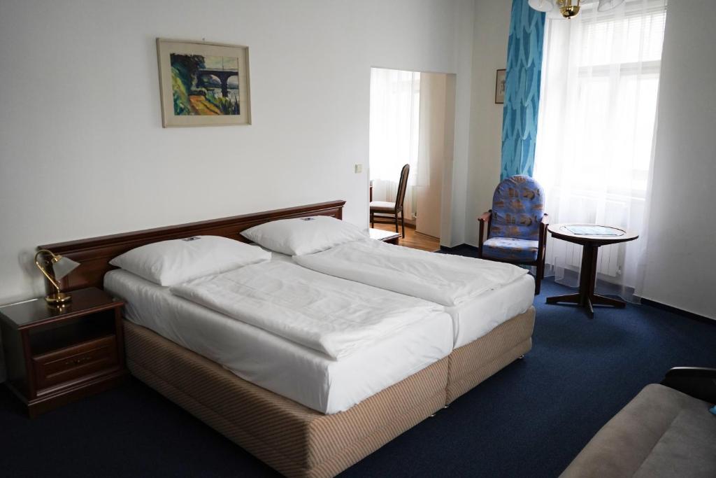 Postel nebo postele na pokoji v ubytování EA Apartmány Mozart