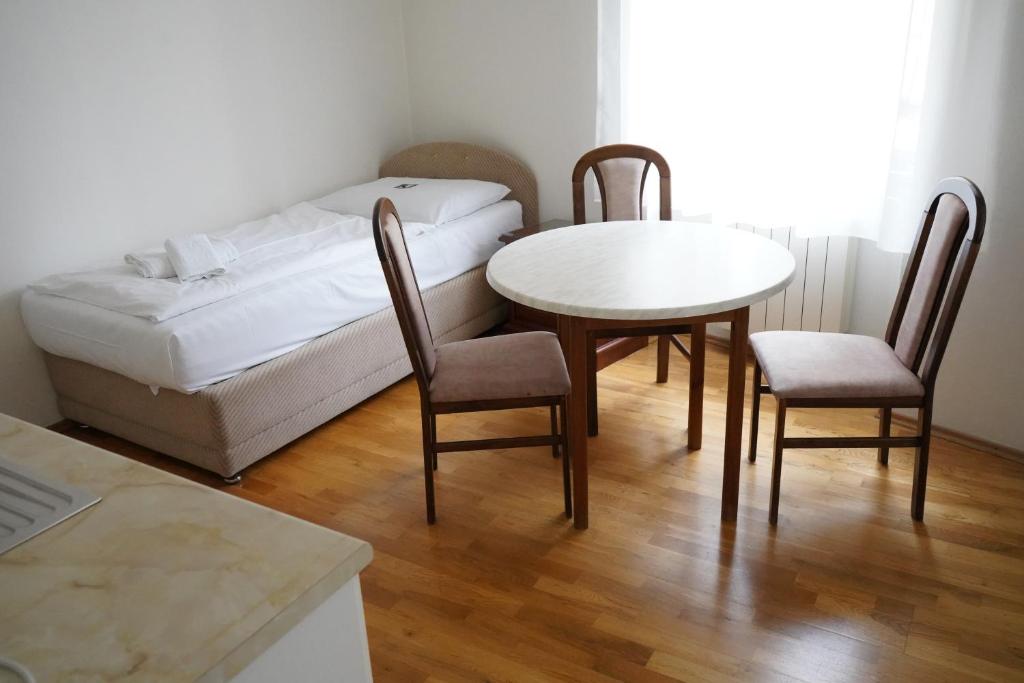 Postel nebo postele na pokoji v ubytování EA Apartmány Mozart