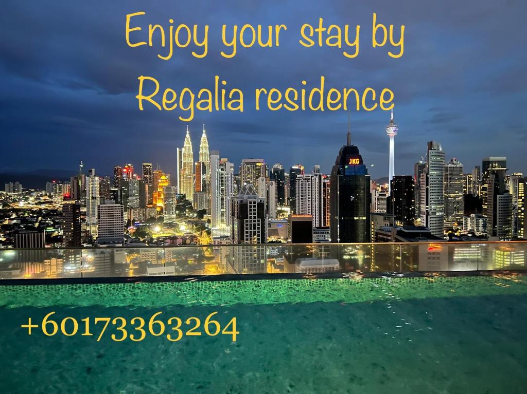 a view of a city skyline at night at Regalia Suites & Residence studio Apartment by Enjoy your stay in Kuala Lumpur