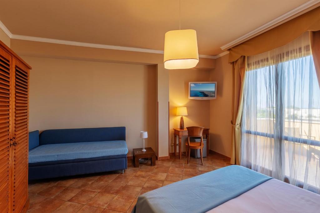 Postel nebo postele na pokoji v ubytování FAVIGNANA HOTEL Concept Holiday