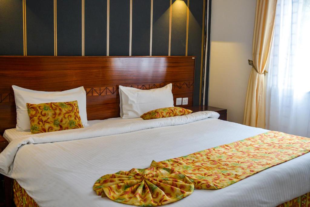 Ένα ή περισσότερα κρεβάτια σε δωμάτιο στο Brickwood Apartments